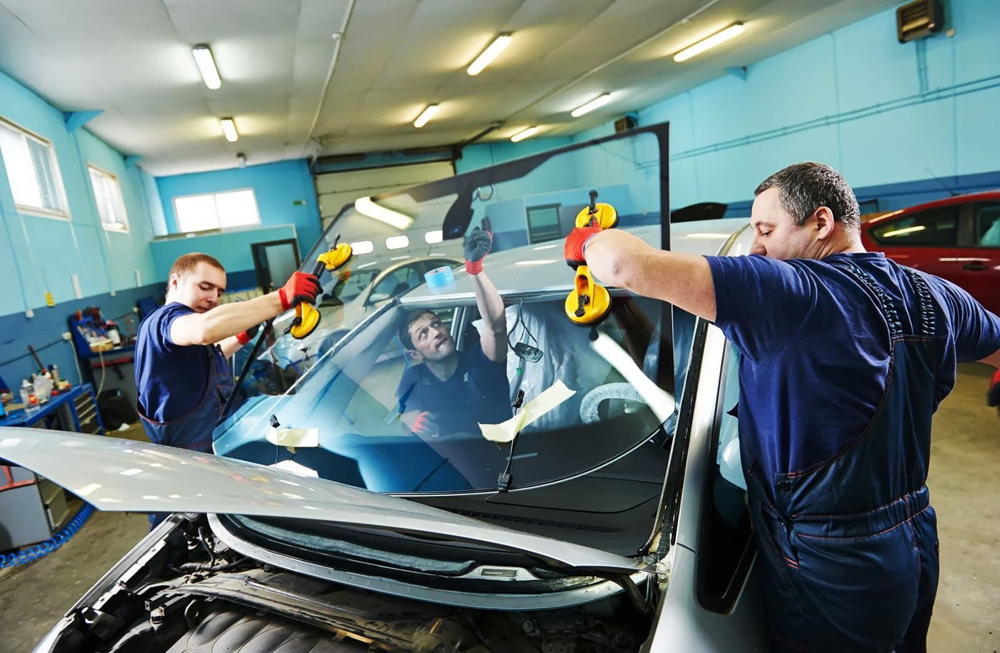 Men replacing glass | Earnhardt Hyundai in Avondale AZ